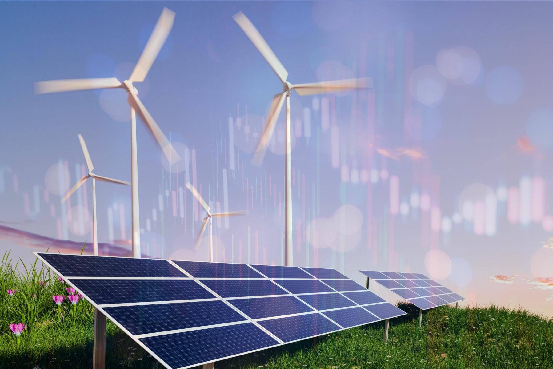 The image shows a green field with large solar panels in the foreground, angled toward the sun, symbolizing renewable energy. Behind the solar panels, several wind turbines are spinning against a clear blue sky. Overlaid on the image are faint, transparent financial graphs, similar to stock market data, creating a visual representation of the intersection between renewable energy production and financial markets.